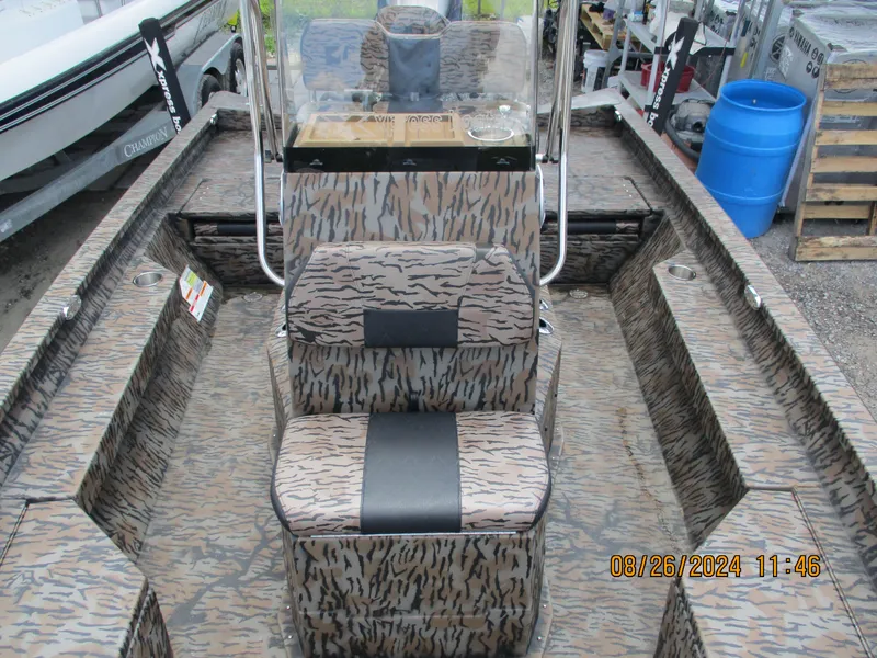 Slide: The Image of 2023 Express H20 Bay boat with camouflage interior design. - 5