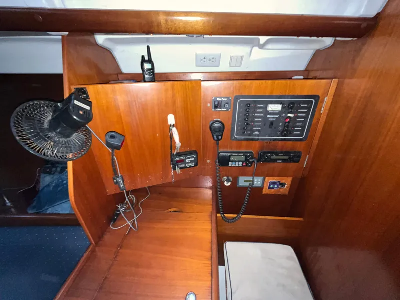 Slide: The Image of 2005 Beneteau Oceanis Clipper 373 navigation station with communication equipment and control panel. - 16