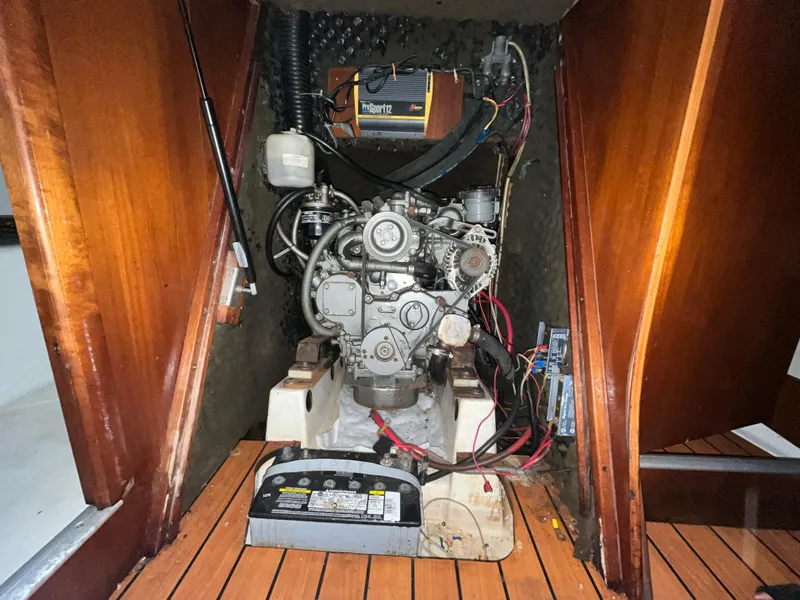 Slide: The Image of Engine compartment of 2005 Beneteau Oceanis Clipper 373 sailboat, featuring mechanical components. - 22