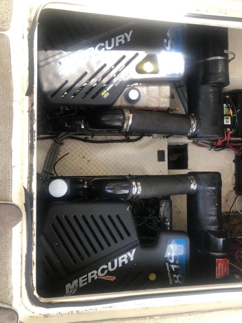 Slide: The Image of Engine compartment of 2001 Cruisers Yachts 3672 Express with Mercury engines. - 11