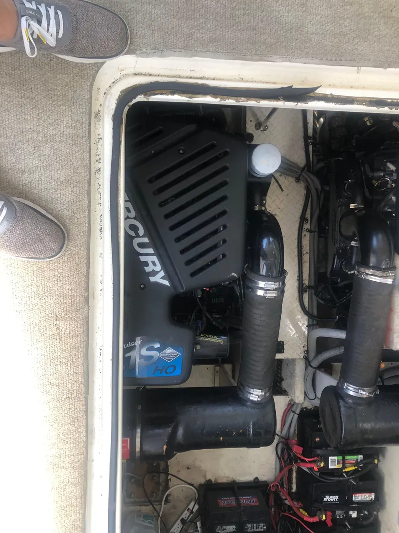 Slide: The Image of 2001 Cruisers Yachts 3672 Express engine compartment with Mercury engine visible. - 12