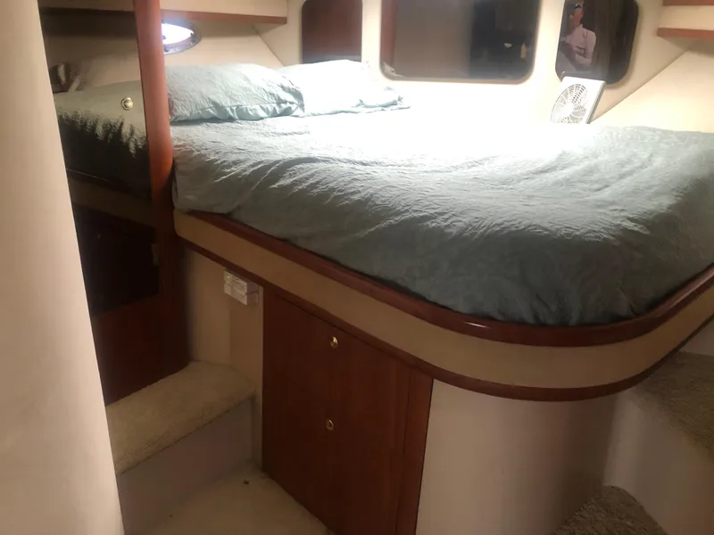 Slide: The Image of Interior cabin of 2001 Cruisers Yachts 3672 Express with bed and storage. - 14