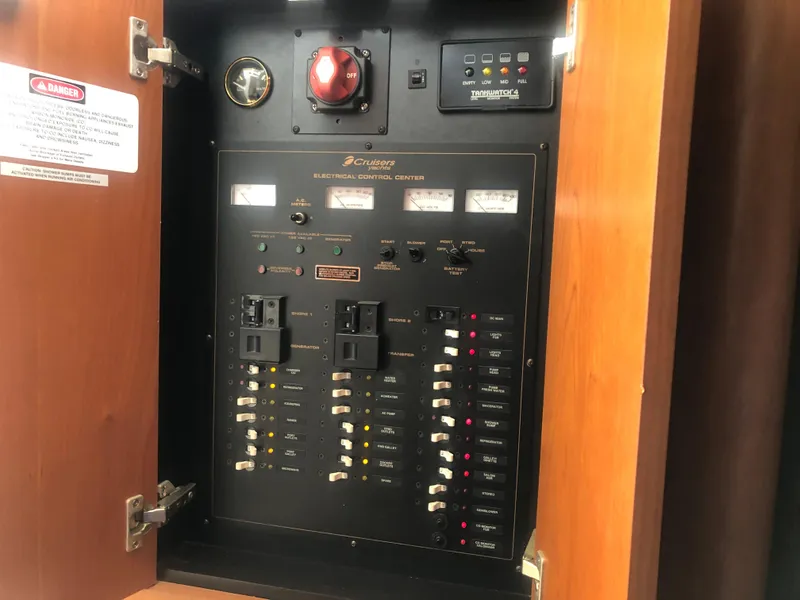 Slide: The Image of Electrical control panel inside 2001 Cruisers Yachts 3672 Express boat. - 19