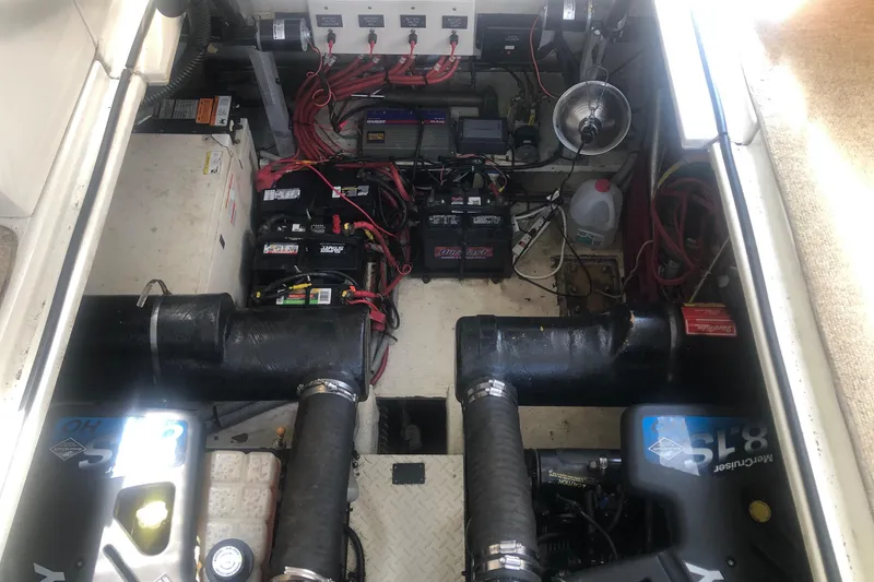 Slide: The Image of Engine room of 2001 Cruisers Yachts 3672 Express with batteries and wiring. - 26