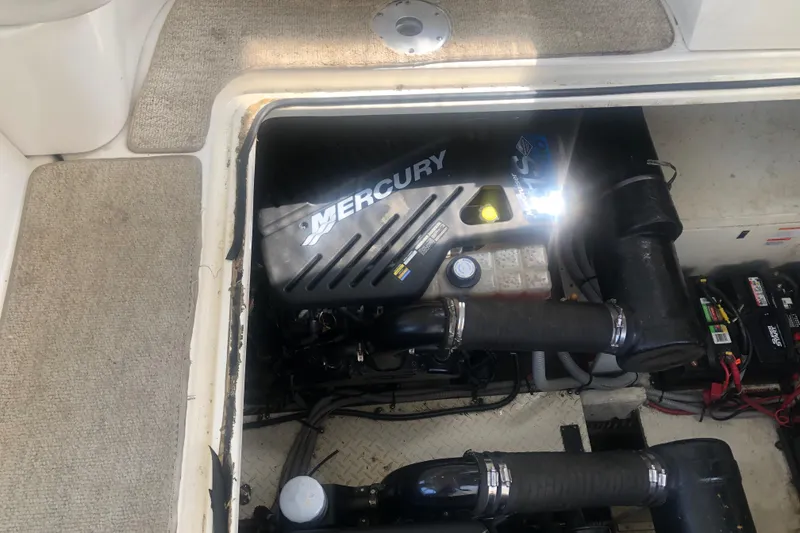 Slide: The Image of Engine compartment of 2001 Cruisers Yachts 3672 Express with Mercury engine visible. - 27