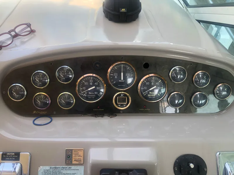 Slide: The Image of Dashboard of 2001 Cruisers Yachts 3672 Express with gauges and controls. - 8
