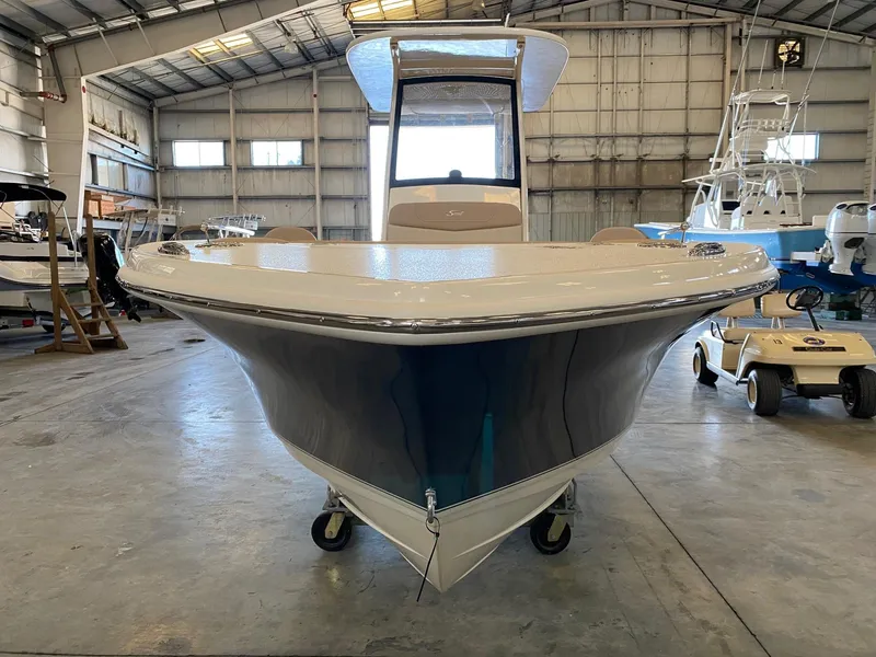 Slide: The Image of 2025 Scout 240 XSF boat in a warehouse, front view. - 5
