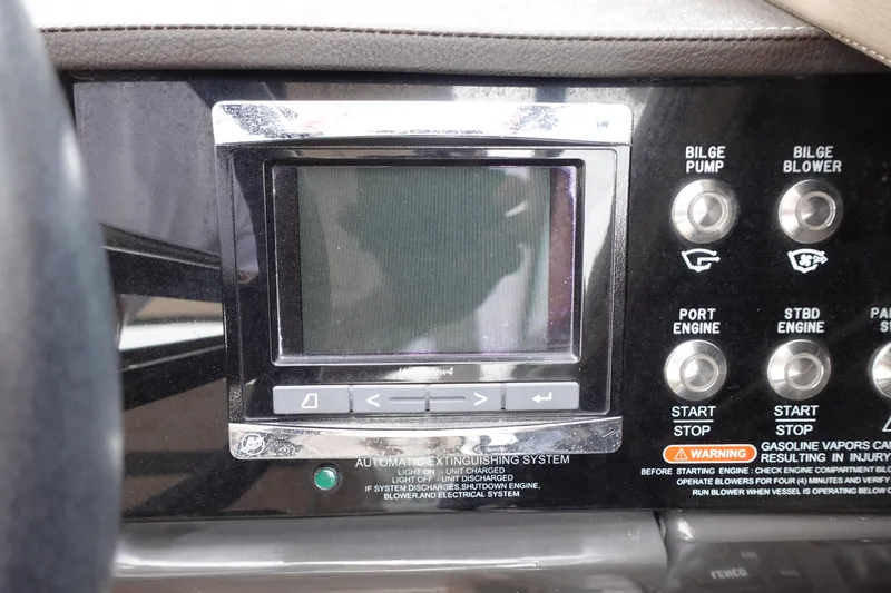 Slide: The Image of Control panel of a 2017 Sea Ray SLX 310 boat with display and engine controls. - 10