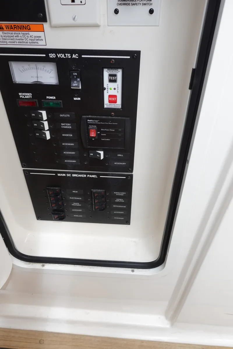 Slide: The Image of Electrical control panel on a 2017 Sea Ray SLX 310 boat. - 11