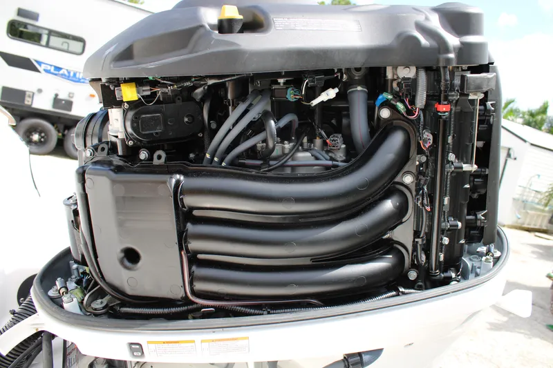 Slide: The Image of 2023 Regal LX6 engine with exposed components and wiring, showcasing intricate mechanical details. - 17