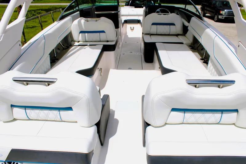 Slide: The Image of 2023 Regal LX6 boat interior with luxurious white seating and modern design. - 20