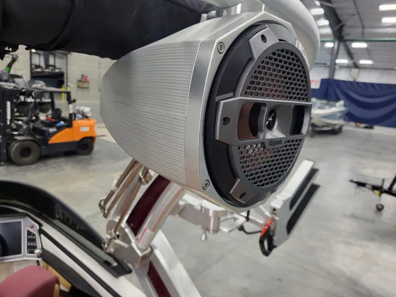 Slide: The Image of 2022 MasterCraft XT23 boat speaker in a warehouse setting. - 14