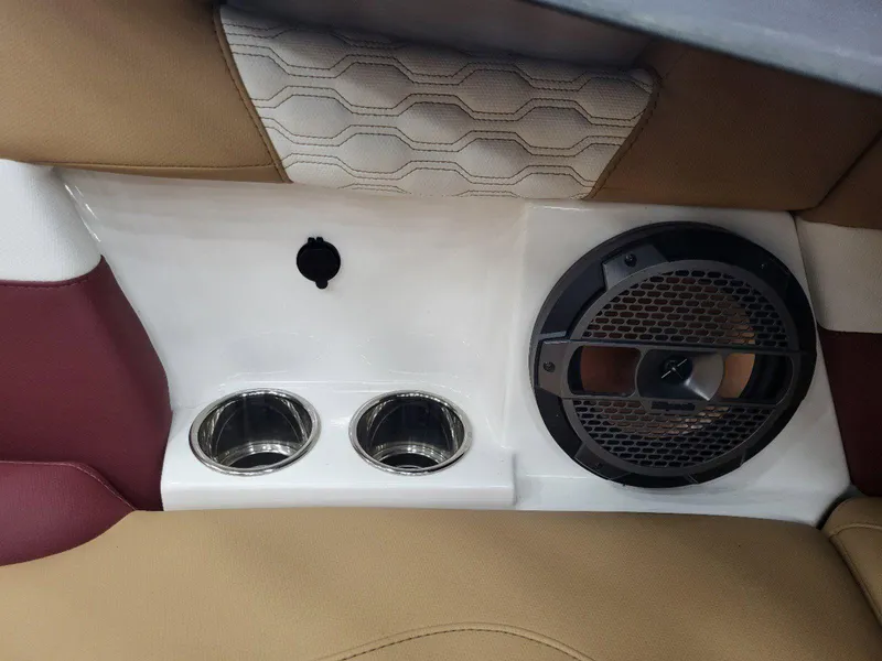Slide: The Image of 2022 MasterCraft XT23 interior with speaker and cup holders. - 22