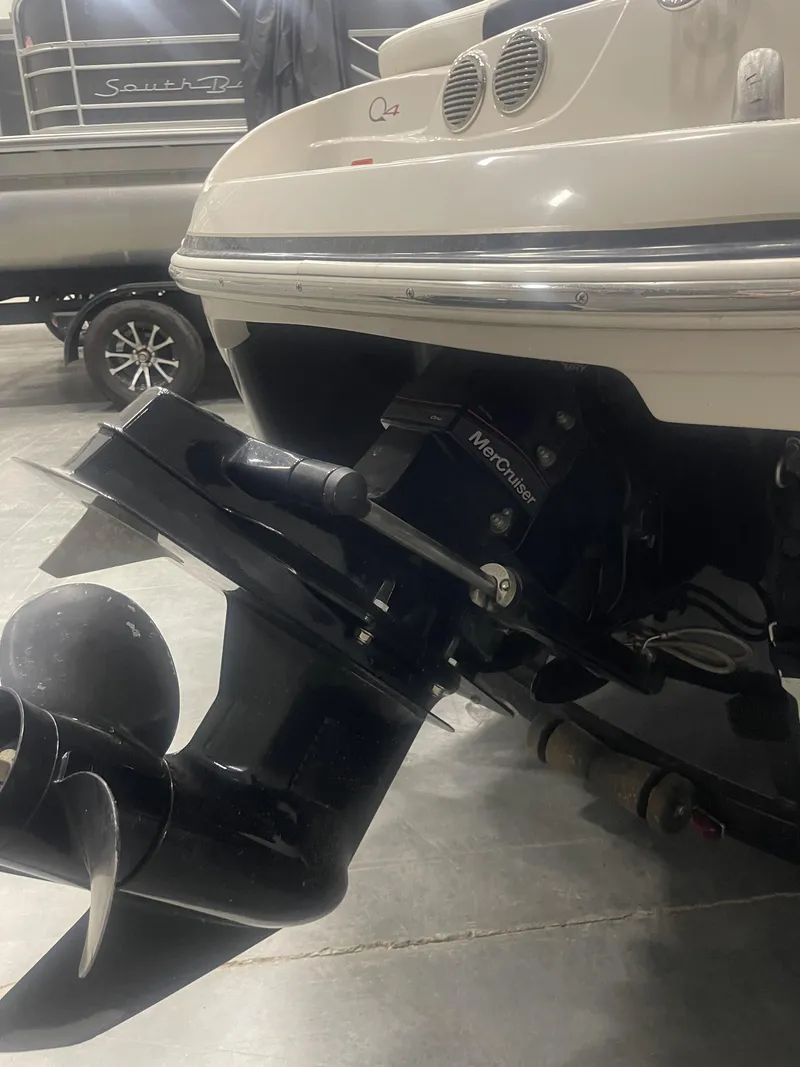 Slide: The Image of 2010 Tracker TAHOE Q4 boat with MerCruiser engine in a garage setting. - 3