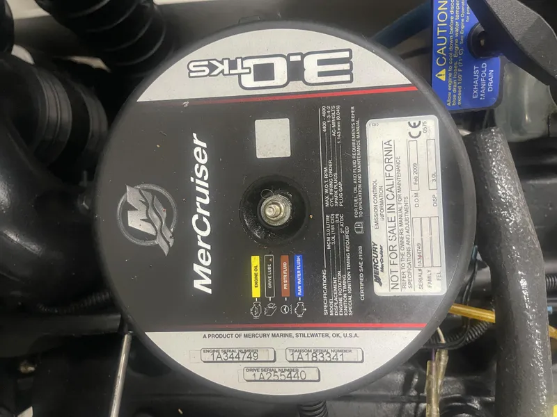 Slide: The Image of MerCruiser engine label on 2010 Tracker TAHOE Q4 boat, showing specifications and serial numbers. - 8
