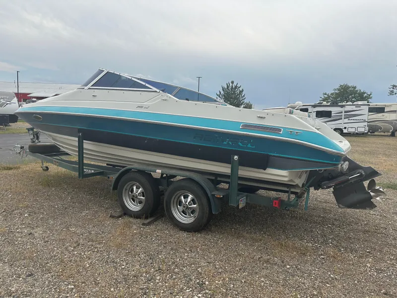 Slide: The Image of 1993 RENEIL REINEL 2400RXL boat on trailer, parked outdoors. - 3