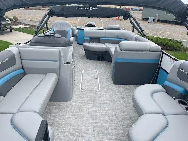 Slide: The Image of 2023 Forest River SOUTH BAY 224FCR pontoon boat with spacious seating and modern design. - 10