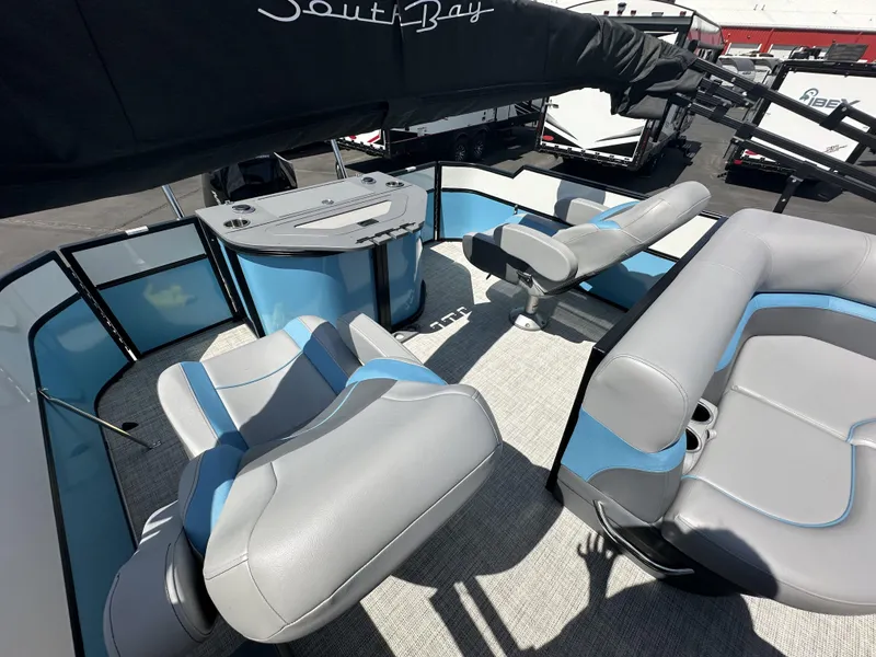 Slide: The Image of 2023 Forest River SOUTH BAY 224FCR pontoon boat interior with modern seating and helm. - 7