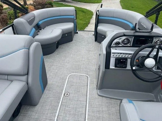 Slide: The Image of 2023 Forest River SOUTH BAY 224FCR pontoon boat interior with modern seating and controls. - 9