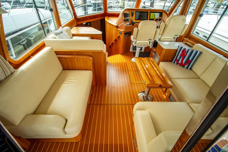 Slide: The Image of Luxurious interior of 2015 Sabre 48 Salon Express yacht with elegant seating and wood finishes. - 1