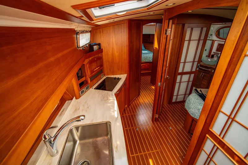 Slide: The Image of 2015 Sabre 48 Salon Express interior with wood finish and modern amenities. - 16