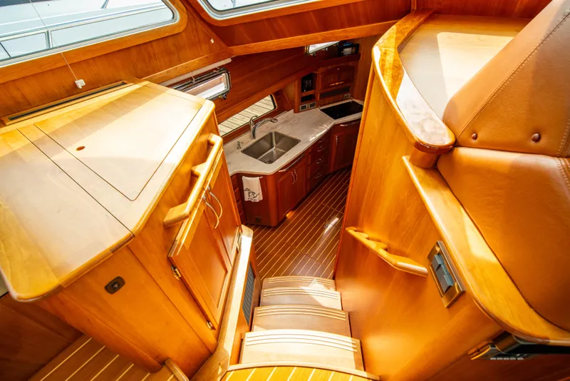 Slide: The Image of Interior of 2015 Sabre 48 Salon Express yacht with wooden cabinetry and stairs. - 18
