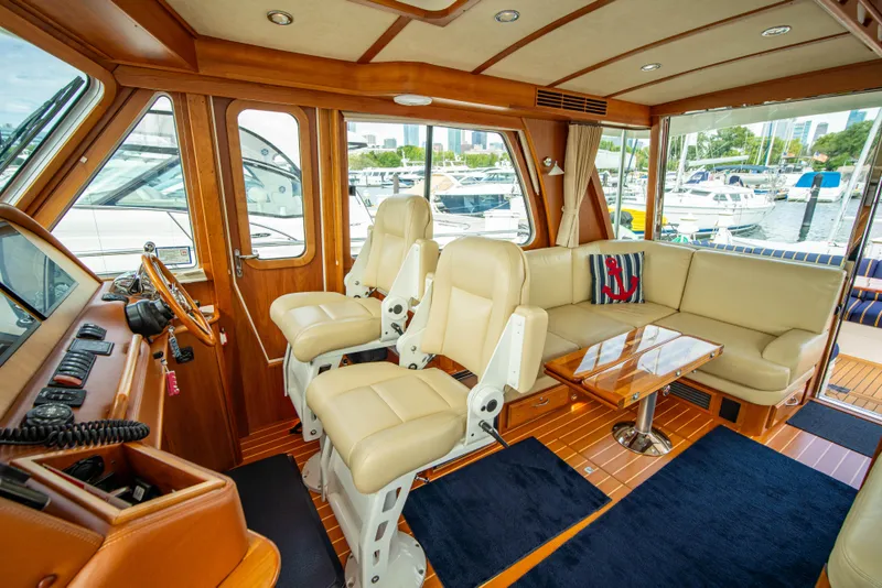 Slide: The Image of Interior of 2015 Sabre 48 Salon Express yacht with luxurious seating and helm. - 24