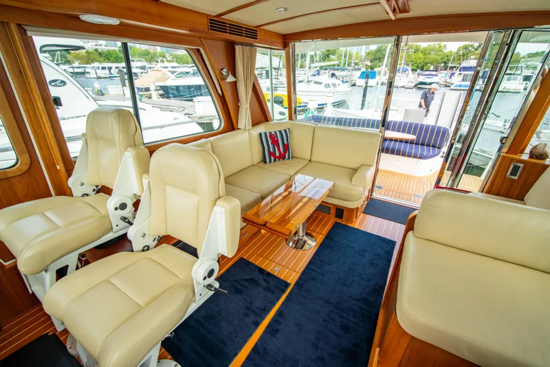 Slide: The Image of Luxurious interior of 2015 Sabre 48 Salon Express yacht with leather seating and wood accents. - 26