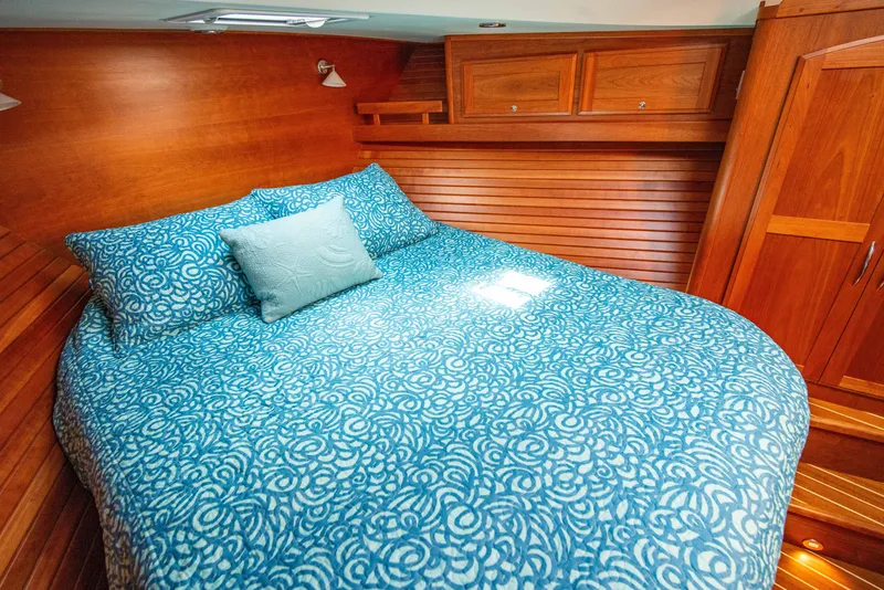 Slide: The Image of Luxurious bedroom in 2015 Sabre 48 Salon Express yacht with blue bedding. - 32