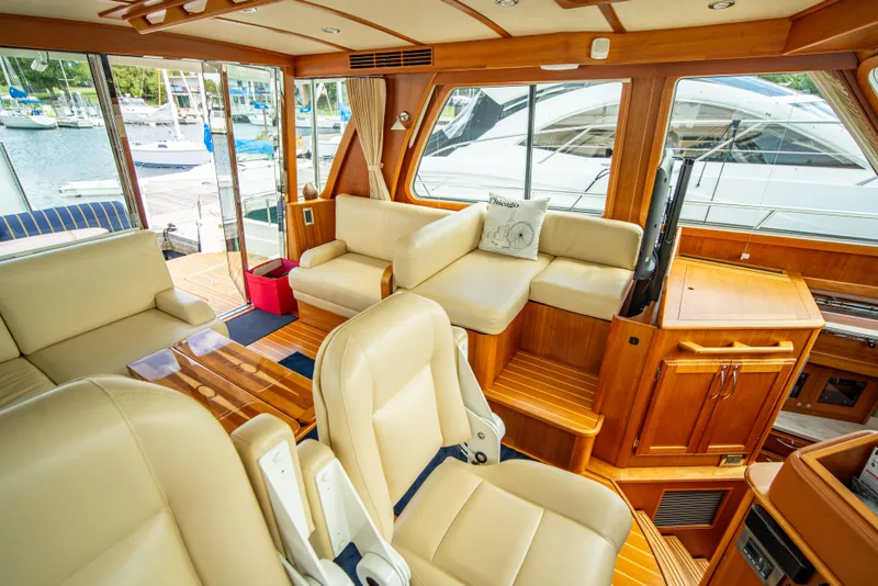 Slide: The Image of Interior of 2015 Sabre 48 Salon Express yacht with luxurious seating and wood finishes. - 33