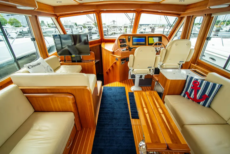 Slide: The Image of Luxurious interior of 2015 Sabre 48 Salon Express yacht with leather seating and modern helm. - 35