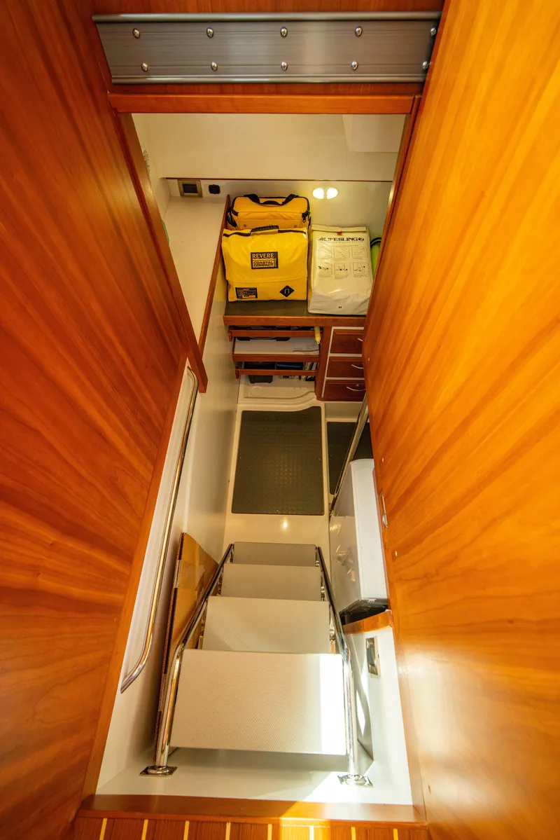 Slide: The Image of Interior storage area of 2015 Sabre 48 Salon Express yacht with wooden finish. - 38