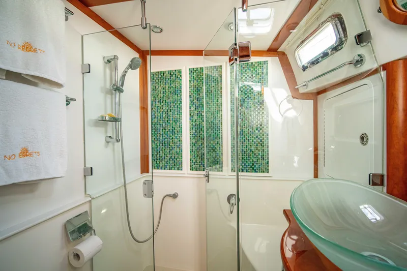 Slide: The Image of Luxurious bathroom in 2015 Sabre 48 Salon Express yacht with glass shower and modern fixtures. - 46