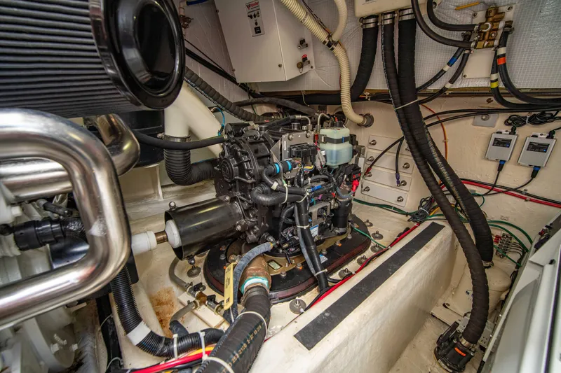 Slide: The Image of Engine room of 2015 Sabre 48 Salon Express with visible machinery and wiring. - 47