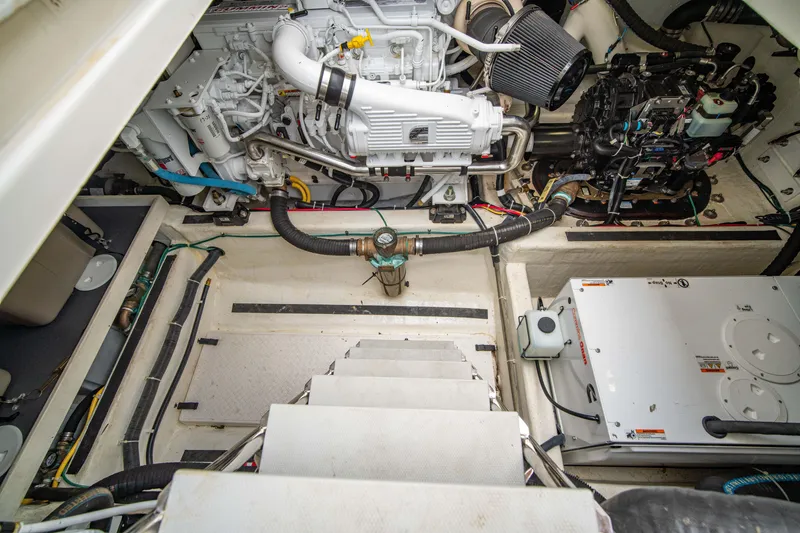 Slide: The Image of Engine room of 2015 Sabre 48 Salon Express yacht, showcasing mechanical components and systems. - 48