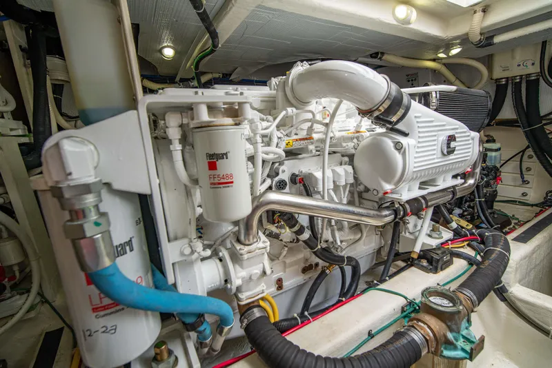 Slide: The Image of Engine room of 2015 Sabre 48 Salon Express yacht, showcasing detailed machinery and components. - 49