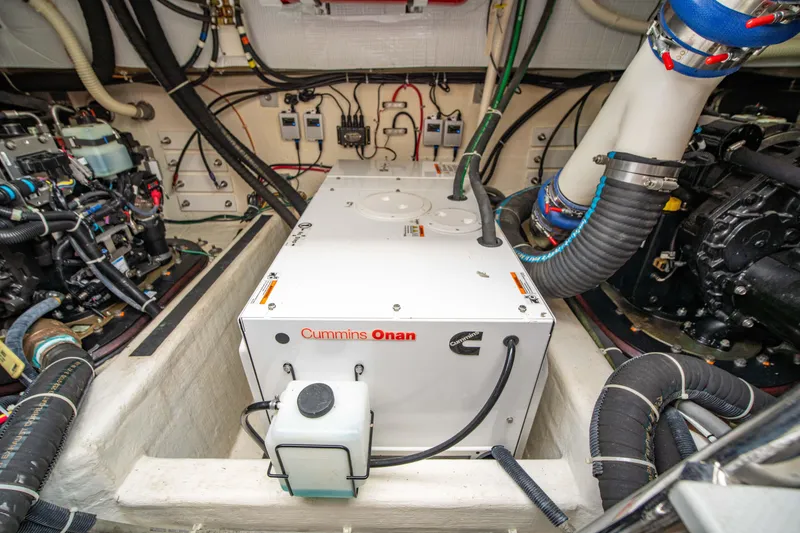 Slide: The Image of Engine room of 2015 Sabre 48 Salon Express with Cummins Onan generator. - 7