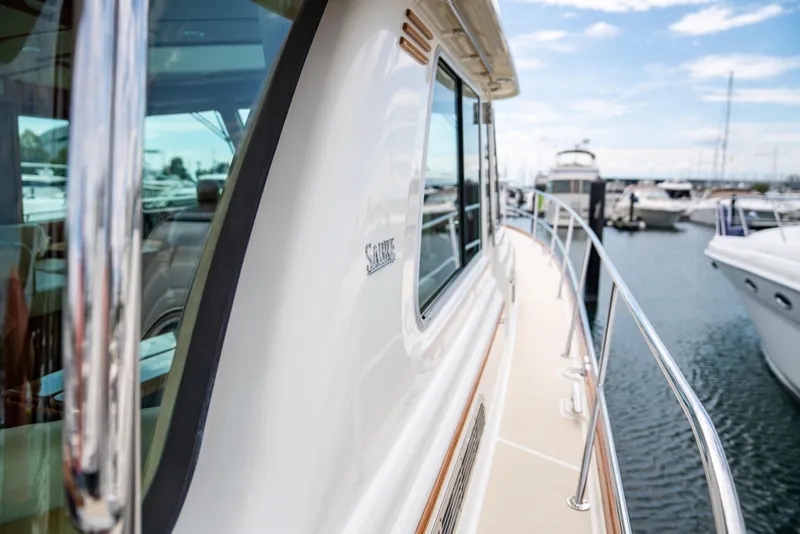 Slide: The Image of Sabre 48 Salon Express 2015 yacht docked at marina, side view. - 9