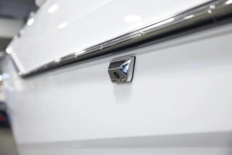 Slide: The Image of Close-up of 2025 Malibu M242 boat detail with chrome trim. - 10