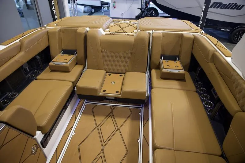 Slide: The Image of Luxurious interior of 2025 Malibu M242 boat with tan leather seating and modern design. - 32
