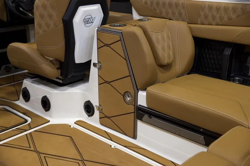 Slide: The Image of Luxurious interior of 2025 Malibu M242 boat with tan leather seating and modern design. - 34