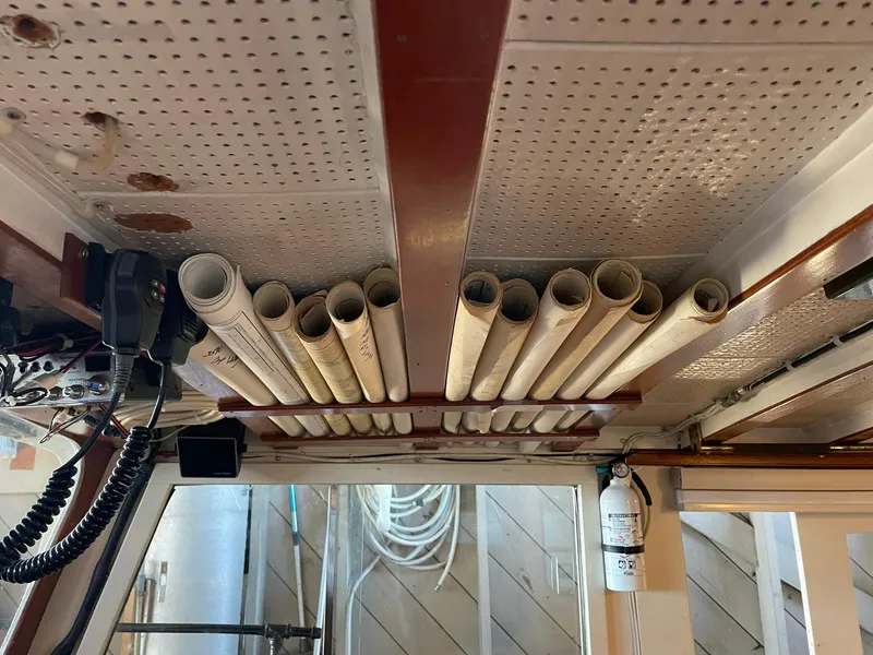 Slide: The Image of Ceiling storage with PVC pipes in a 1940 Historic Tacoma Boat Co Cruiser. - 24