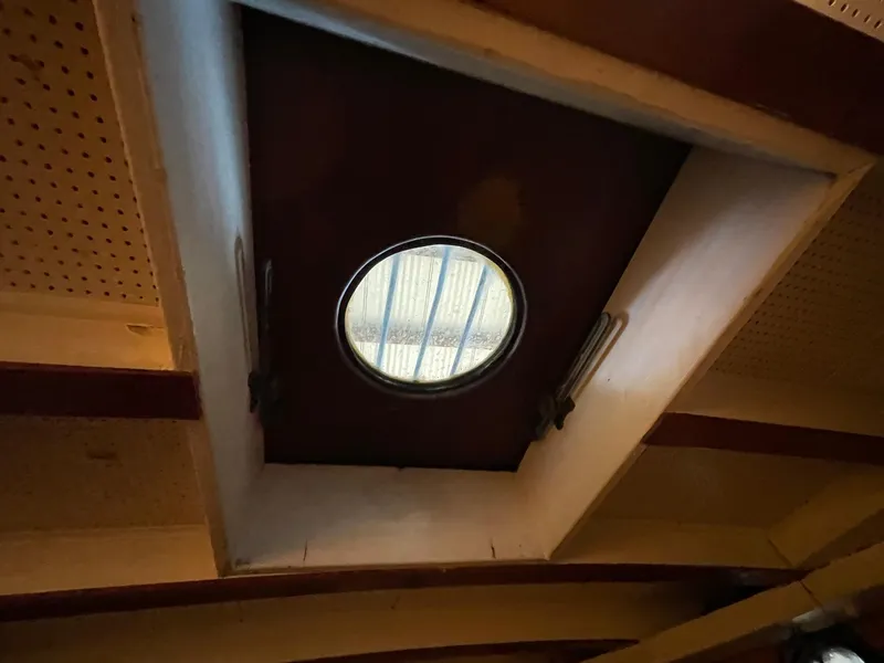 Slide: The Image of Circular porthole window on 1940 Historic Tacoma Boat Co Cruiser ceiling. - 27