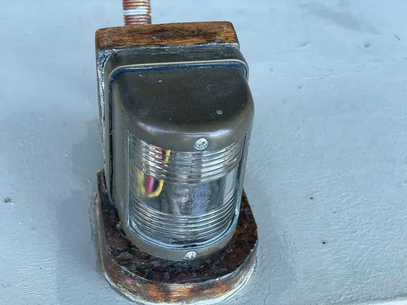 Slide: The Image of 1940 Historic Tacoma Boat Co Cruiser navigation light on wooden base. - 38