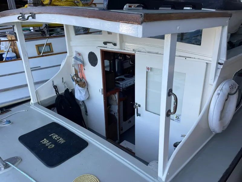 Slide: The Image of 1940 Historic Tacoma Boat Co Cruiser with open cabin and visible interior details. - 39