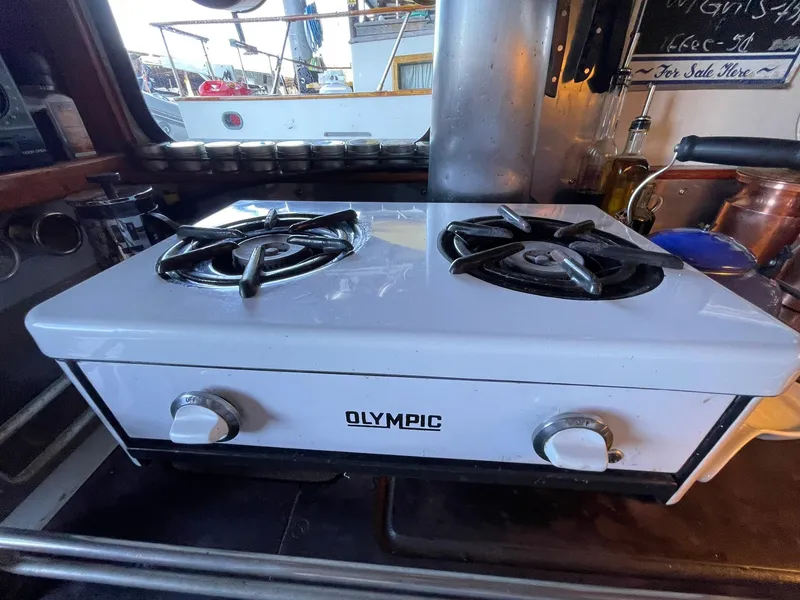 Slide: The Image of Two-burner Olympic stove inside a 1940 Historic Tacoma Boat Co Cruiser. - 8