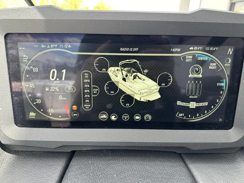 Slide: The Image of 2023 Malibu 22 LSV dashboard display with boat controls and navigation features. - 16