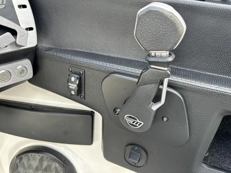 Slide: The Image of 2023 Malibu 22 LSV boat throttle control and dashboard detail. - 20