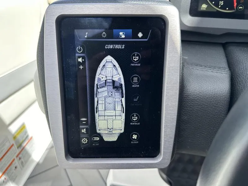 Slide: The Image of 2023 Malibu 22 LSV boat control panel with touchscreen interface. - 21