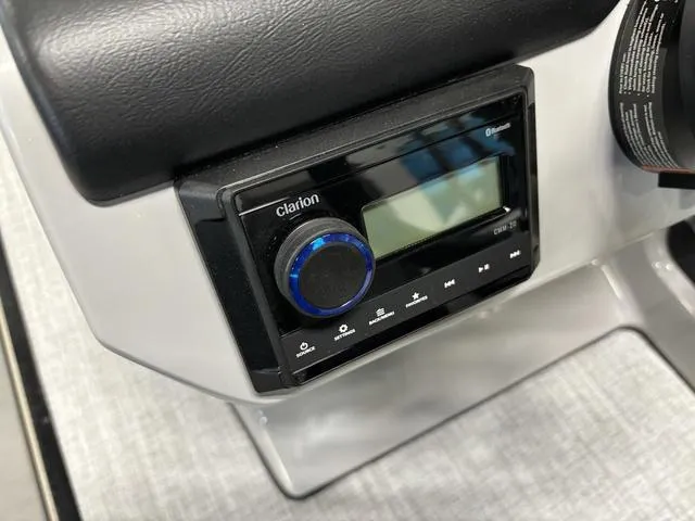 Slide: The Image of 2025 Harris CRUISER 230 SLDH boat dashboard with Clarion audio system. - 13